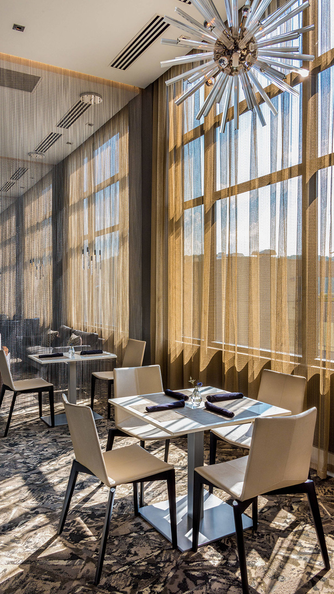 Our team used natural lighting in AC Marriott to create a warm, welcoming seating area.