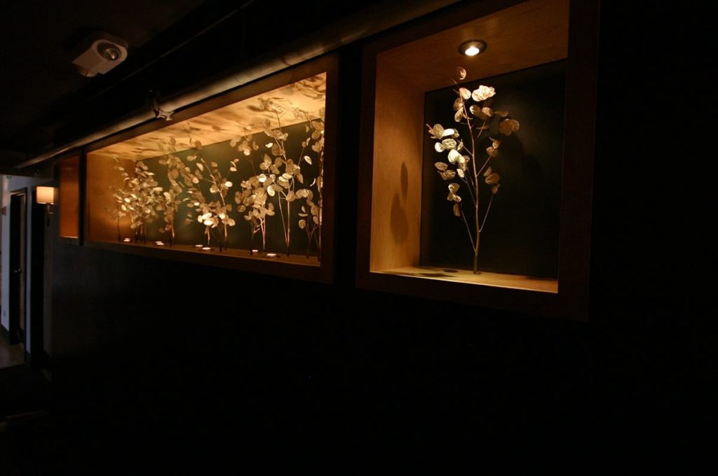 Elegant Leaf Accents - Dark Wood Paneling With Warm Lighting - Asheville, NC